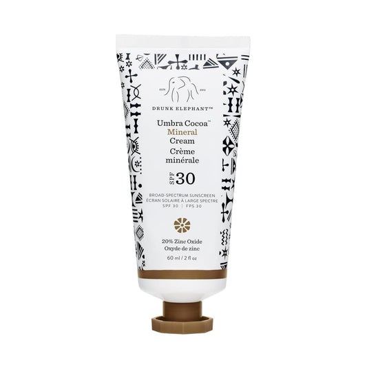 Drunk Elephant Umbra Cocoa Mineral Cream bottle close-up showing mineral SPF protection for daily use.