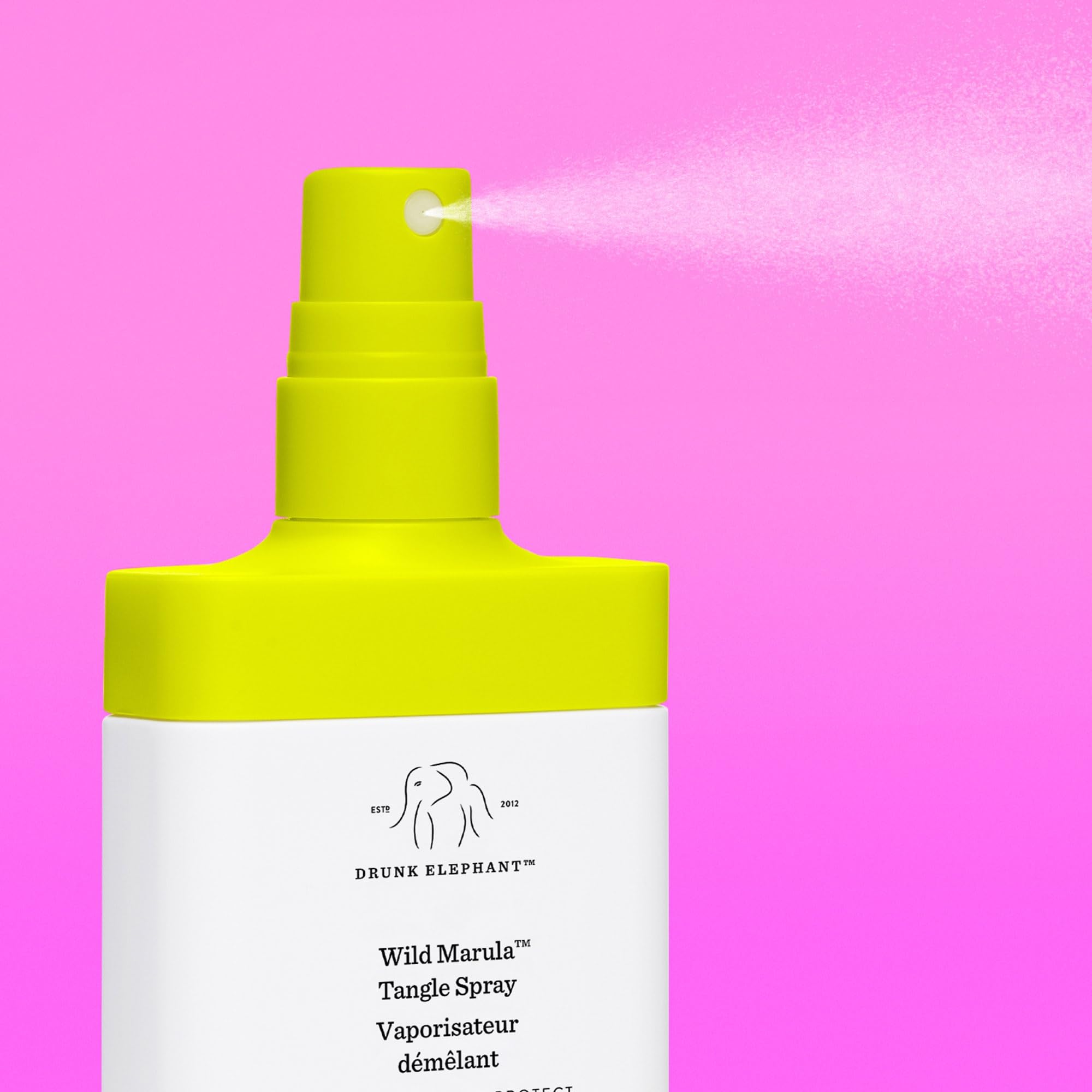Drunk Elephant Wild Marula Tangle Spray applied to damp hair for smoother styling