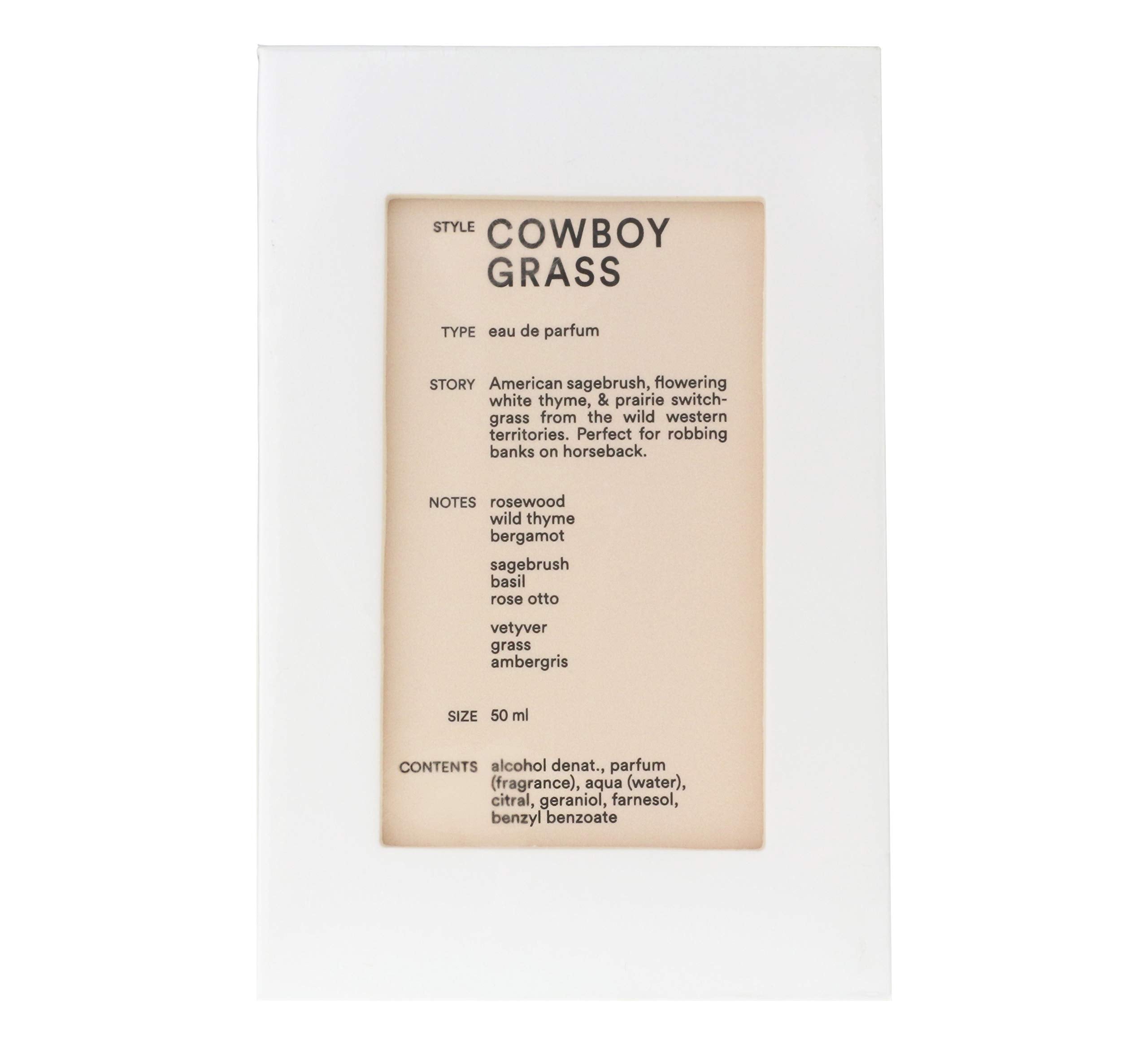 Cowboy Grass bottle on wood surface showing rustic heritage and lasting fragrance