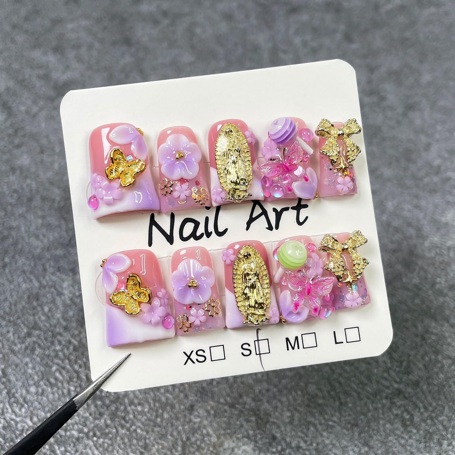 Duck press-on nails with bow and butterfly accents for elegant, quick at-home manicure.