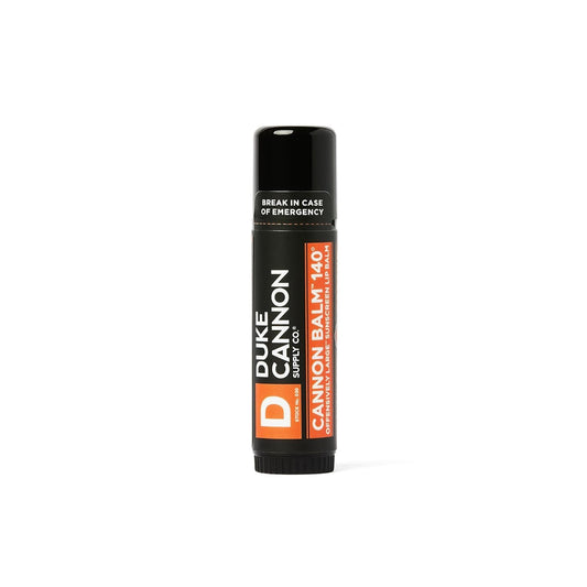 Duke Cannon Balm 140° lip balm with blood orange mint flavor on rugged packaging.