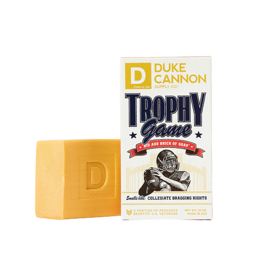 Duke Cannon Trophy Game bar shown with dense lather for tough grime