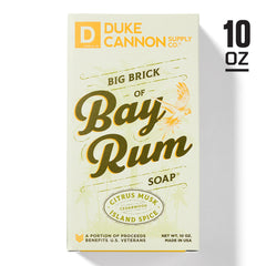 Wet Duke Cannon Big Brick Soap in hand forming rich lather