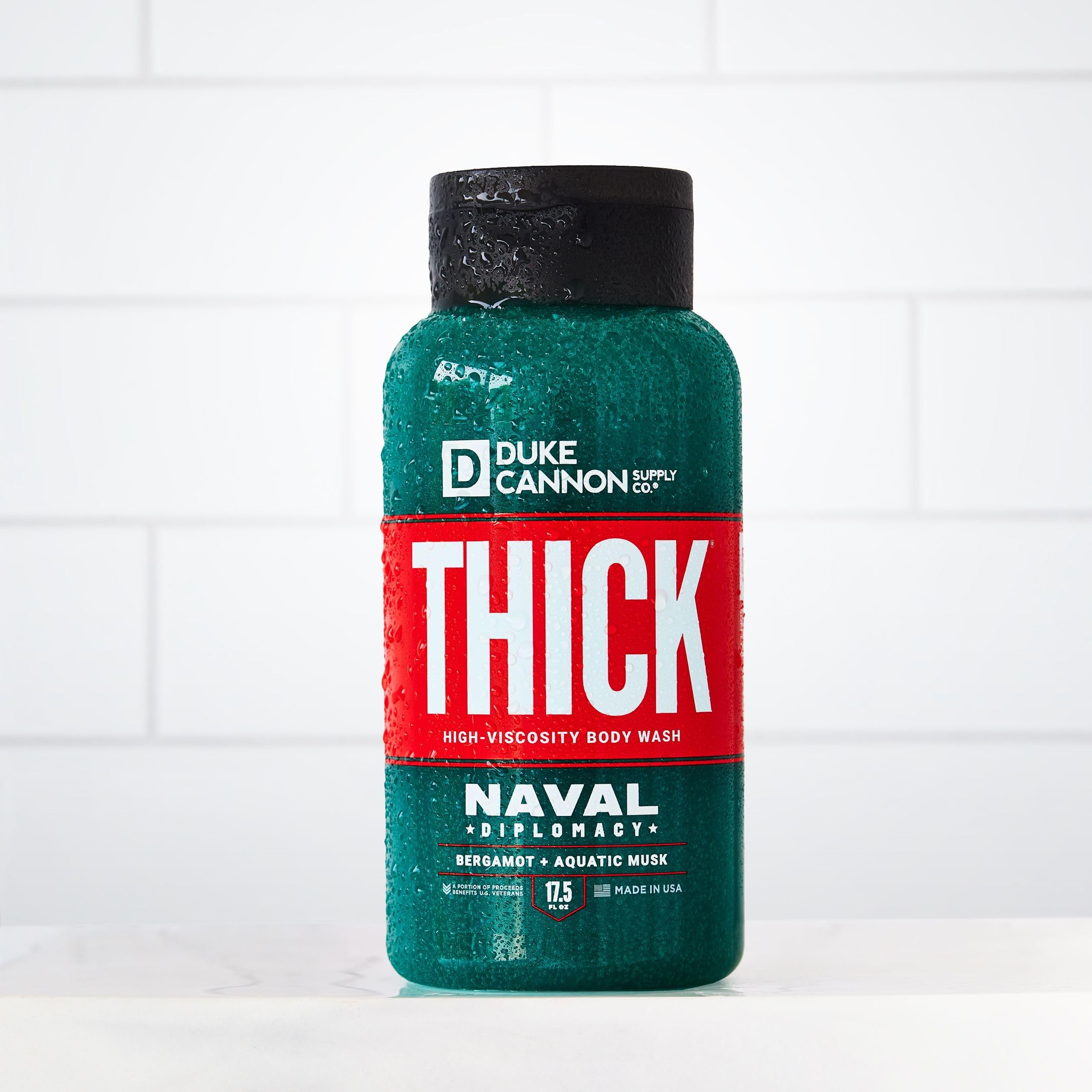 Duke Cannon Naval Diplomacy men's grooming shot with easy-to-use wash in hand