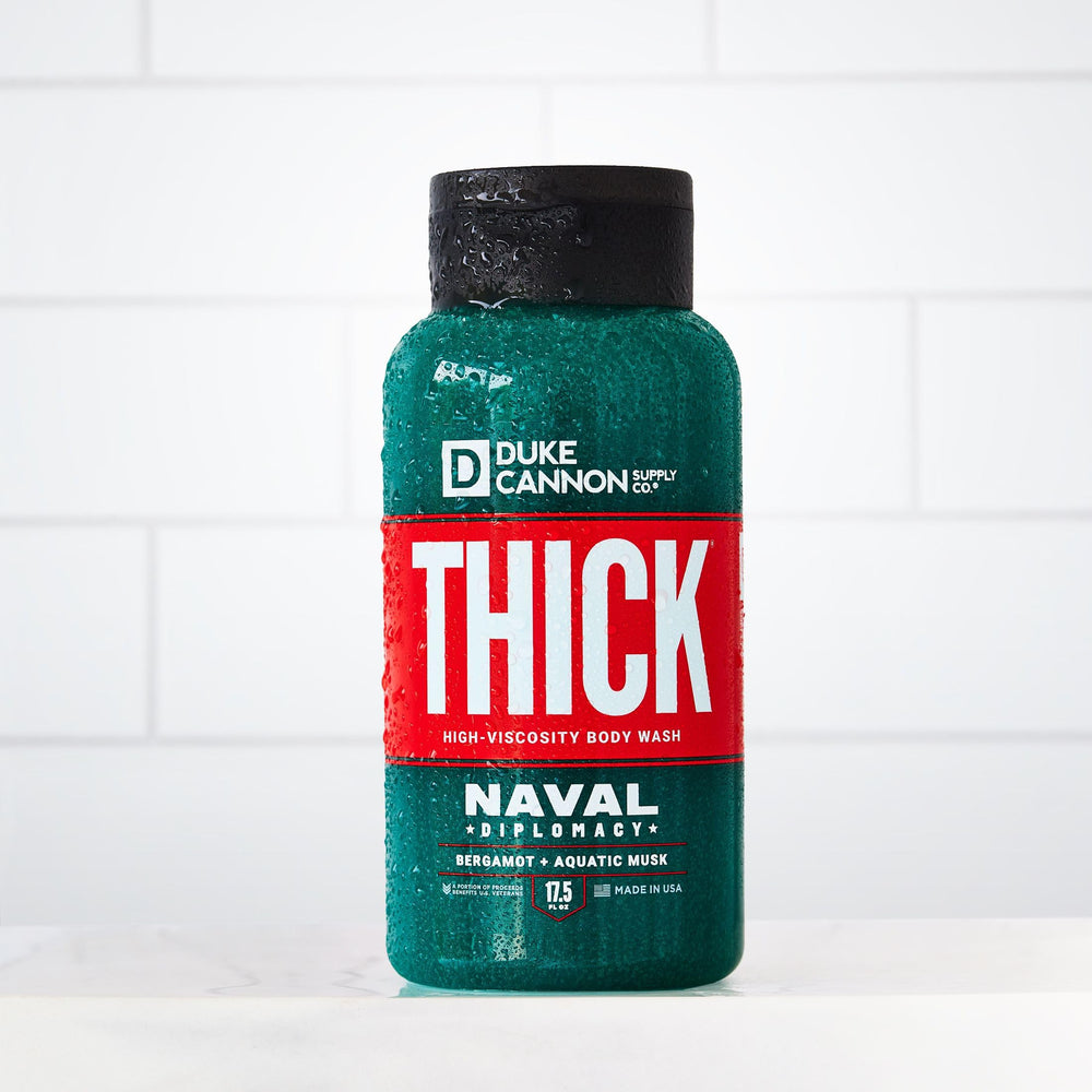 Duke Cannon Naval Diplomacy men's grooming shot with easy-to-use wash in hand