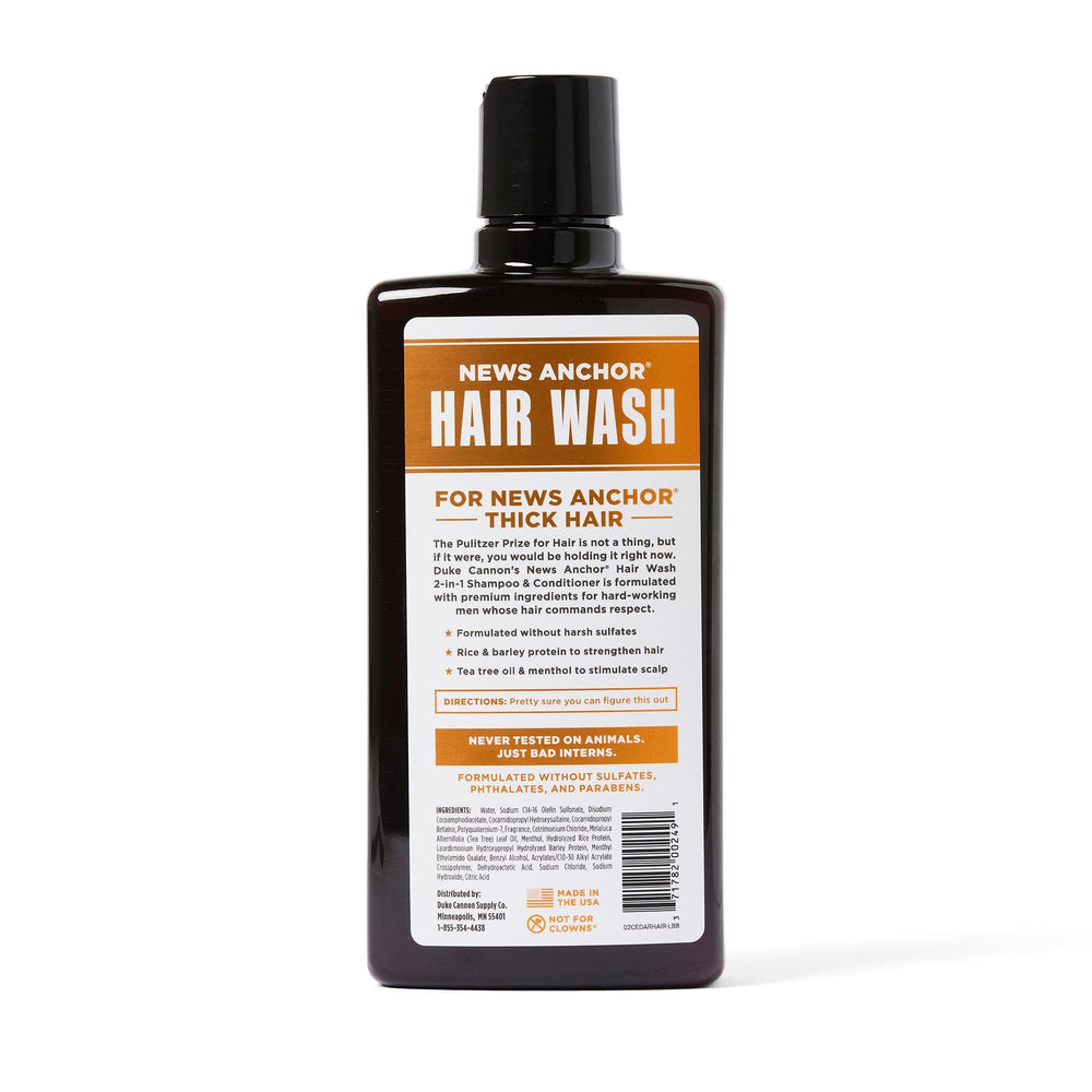 Duke Cannon News Anchor 2-in-1 Hair Wash bottle close-up highlighting cedarwood scent and refreshing feel.
