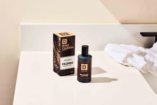 Duke Cannon Palomino on dresser with leather texture cues scent heritage and versatility.