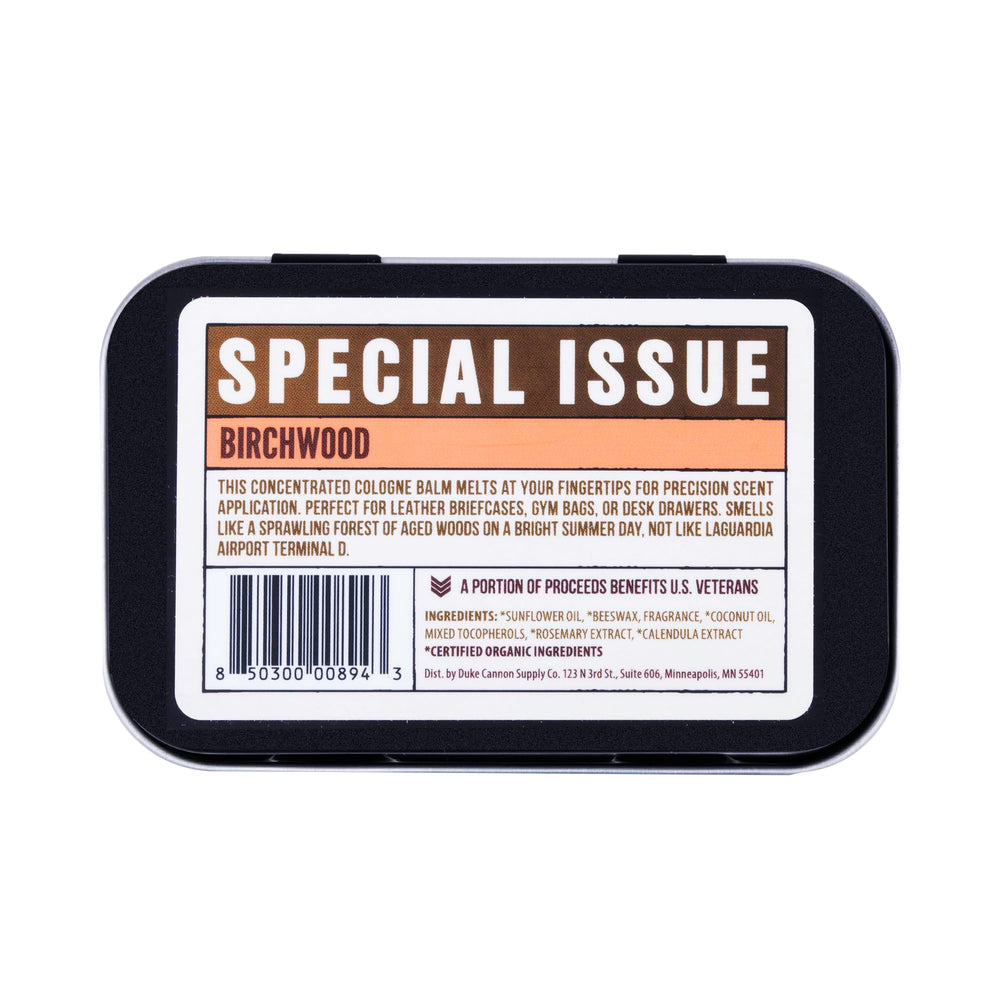 Duke Cannon Birchwood solid cologne tin front view; compact travel fragrance.