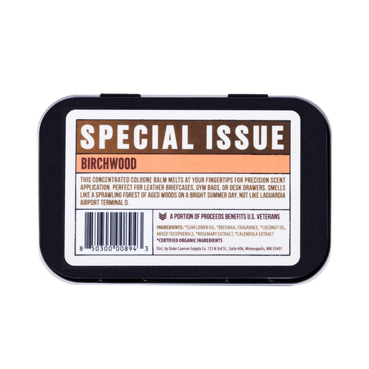 Duke Cannon Birchwood solid cologne tin front view; compact travel fragrance.