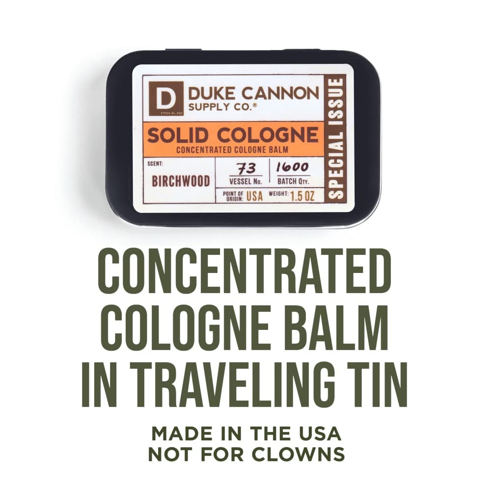 Duke Cannon Birchwood solid cologne tin opened shows balm texture for precise application.
