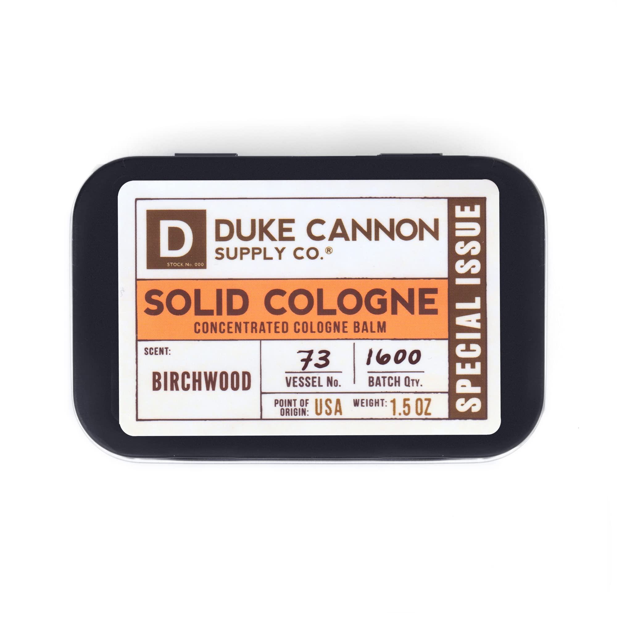 Duke Cannon Birchwood tin in leather briefcase demonstrates travel-friendly fragrance.