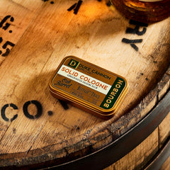 Duke Cannon travel tin sits on desk for quick refresh.