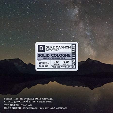 Duke Cannon solid cologne tin open display highlighting compact design.