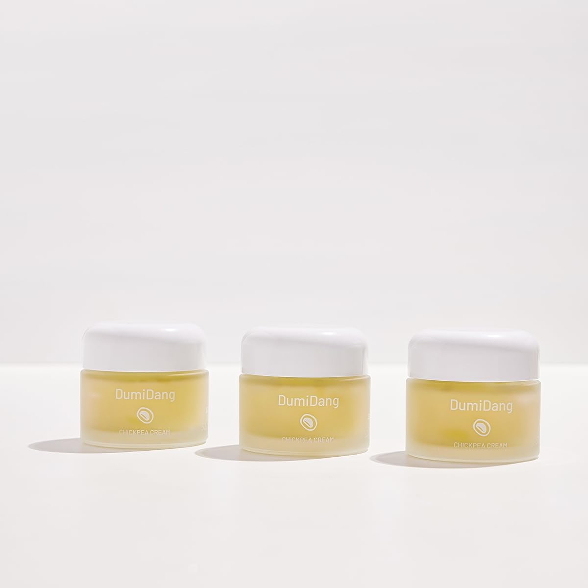 DumiDang Chickpea Cream on vanity shelf for daily hydration routine.