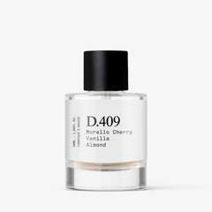 Dupe. Paris D.409 packaging emphasizes vegan, clean ingredients for responsible luxury.