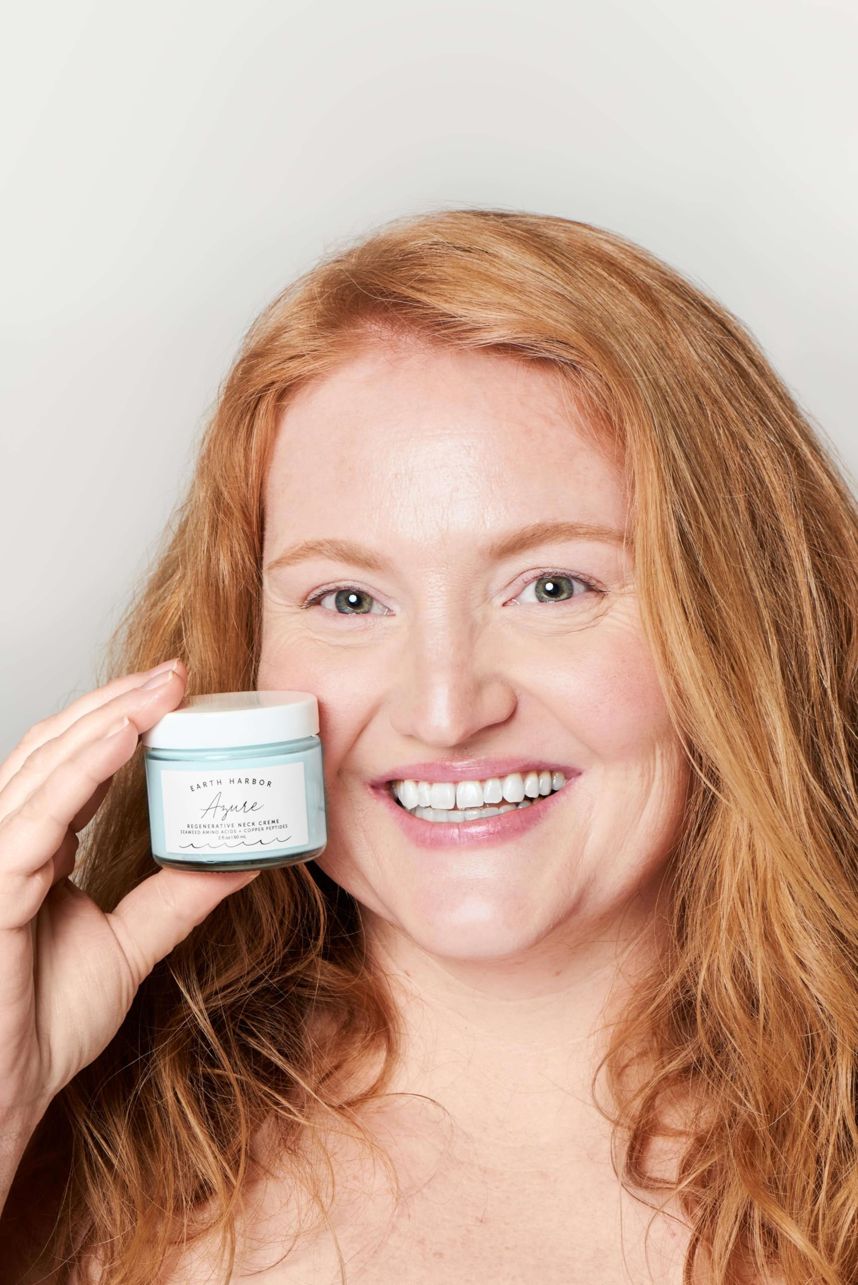 Earth Harbor Azure Neck Creme texture swirl shows sea-inspired formula.