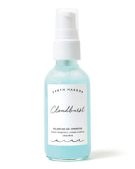 Earth Harbor Cloudburst bottle pour showing light hydration for daily use