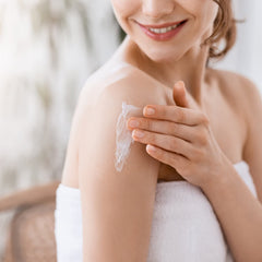 Earth To Skin balm texture on hand demonstrates smooth, non-greasy hydration.