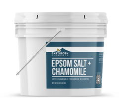 Earthborn Elements chamomile Epsom salt bath scene with real flowers creating spa ambiance