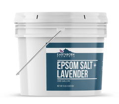 Earthborn Elements Lavender Epsom Salt with essential oil vial for aromatic spa moments.