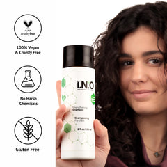 Earthly Body Inside Out Shampoo bottle with towel-ready shower setup.