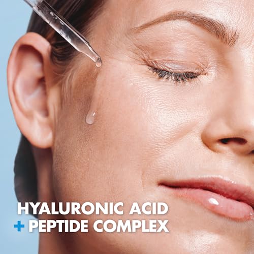 Close-up of dropper releasing serum for deep hydration