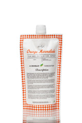 Ecoslay Orange Marmalade bottle pouring, controlled application for defined curls.