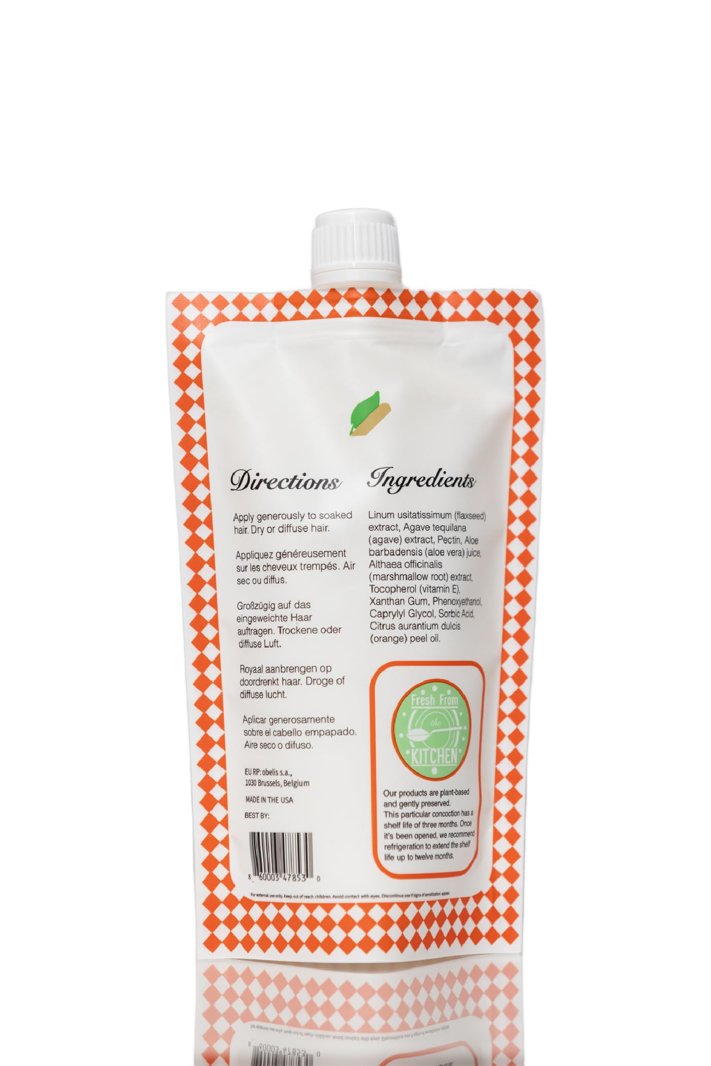 Frizz control with Ecoslay Orange Marmalade smoothing flyaways.