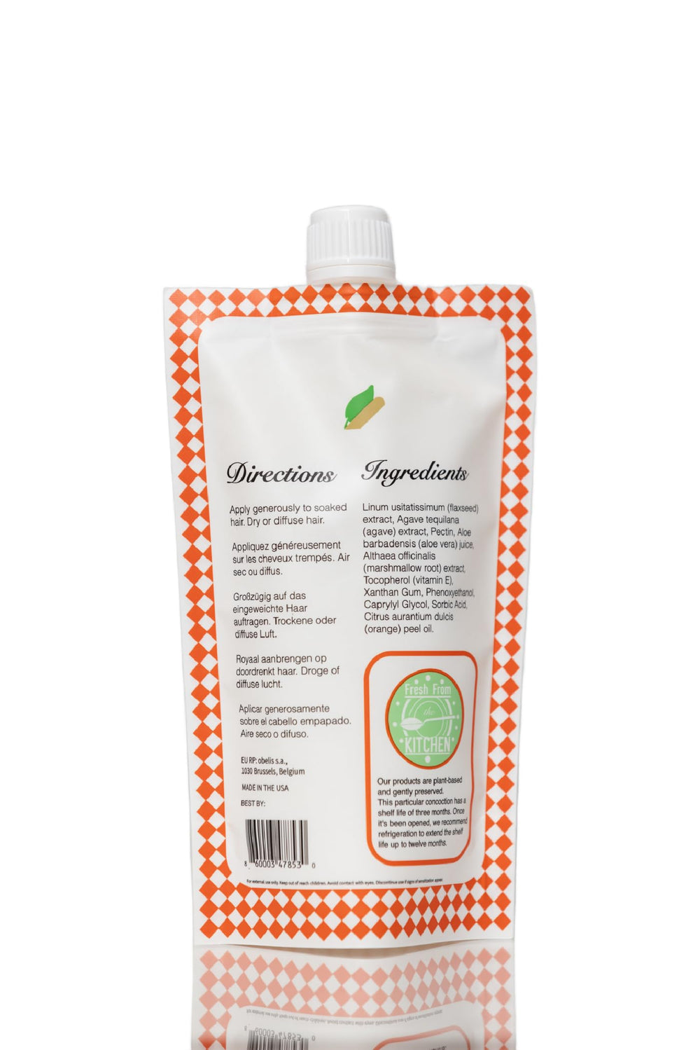 Frizz control with Ecoslay Orange Marmalade smoothing flyaways.