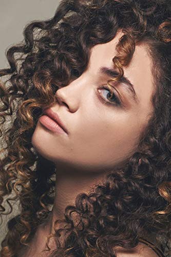 Ecru New York Curl Perfect Defining Styling Potion being applied on damp hair helps define curls.