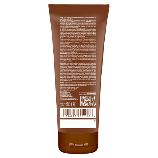 Close-up texture of ED HARDY Coconut Kisses lotion for smooth, hydrated skin.