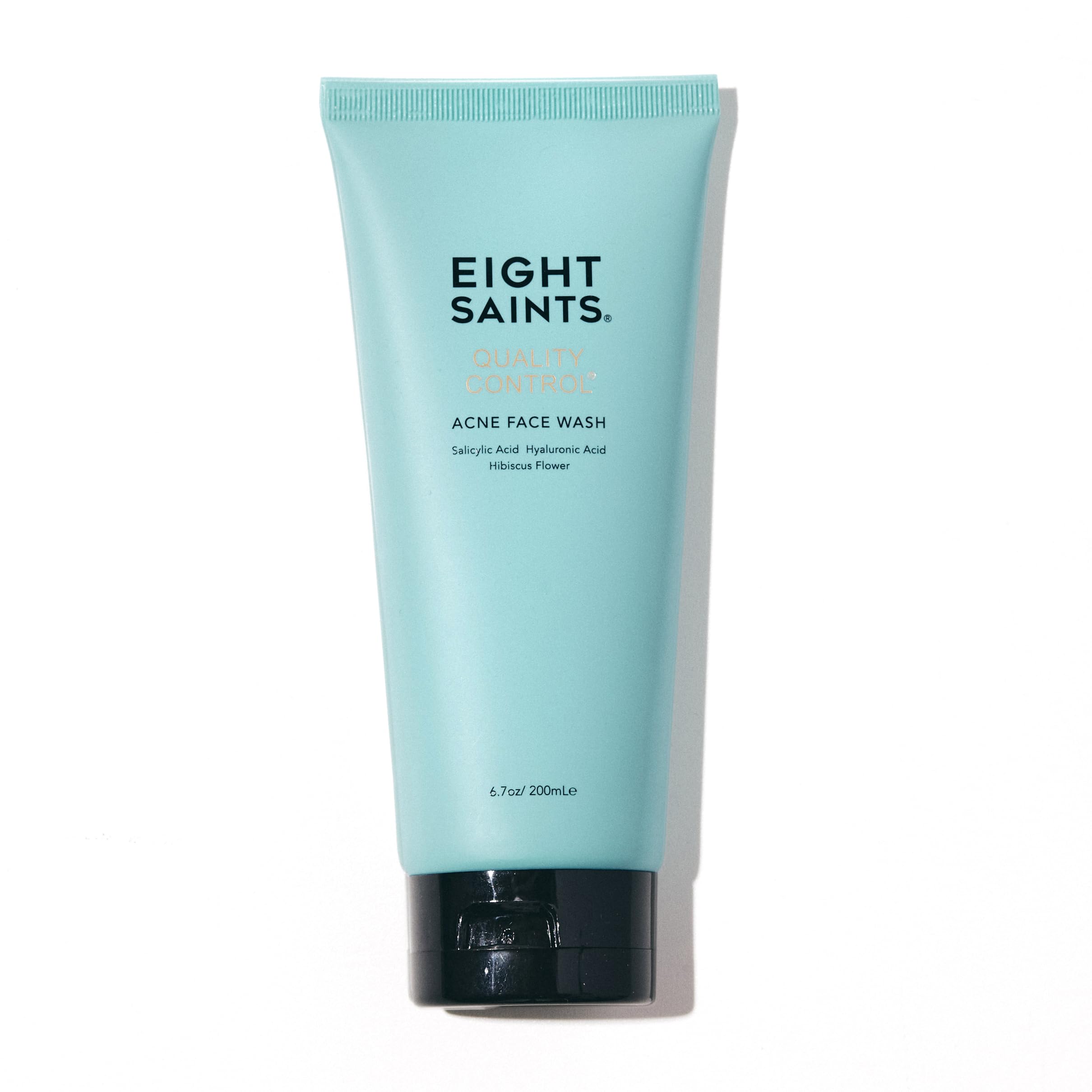 Eight Saints Quality Control Acne Face Wash bottle on a bathroom shelf for daily cleansing.