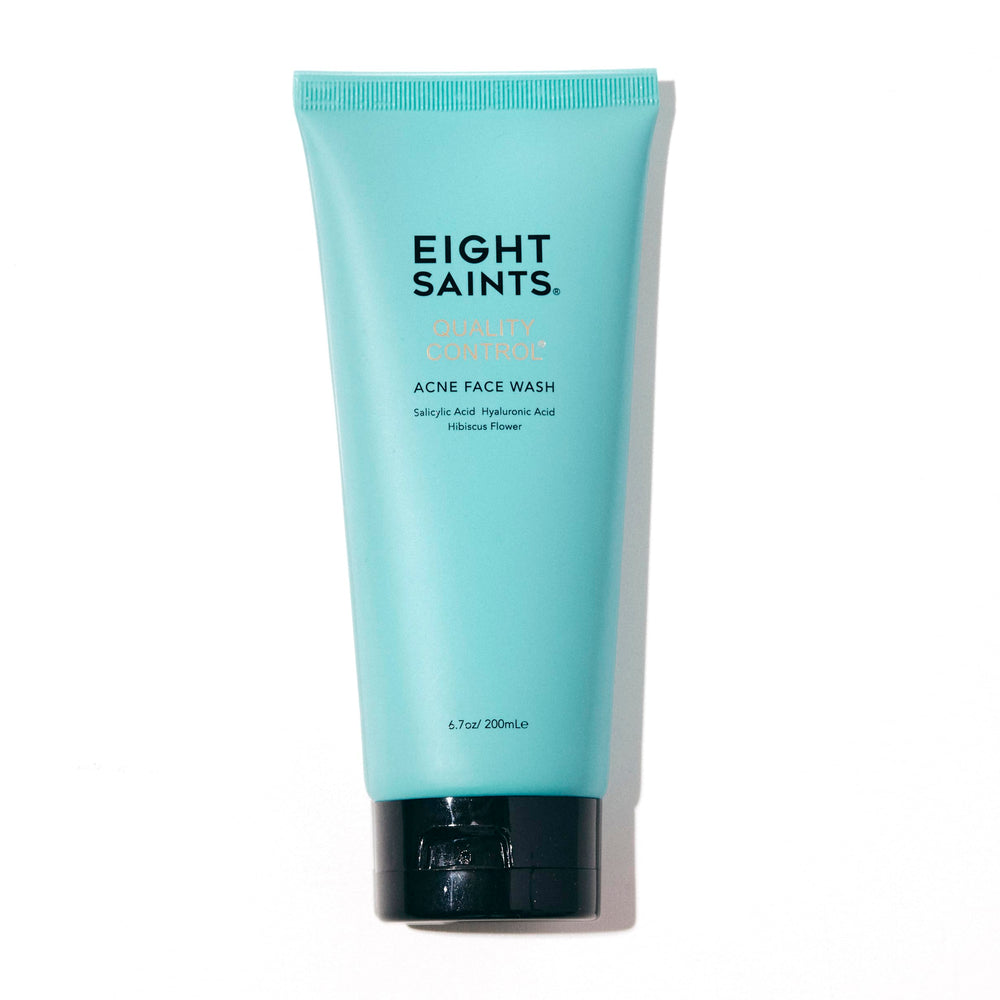 Eight Saints Quality Control Acne Face Wash bottle on a bathroom shelf for daily cleansing.