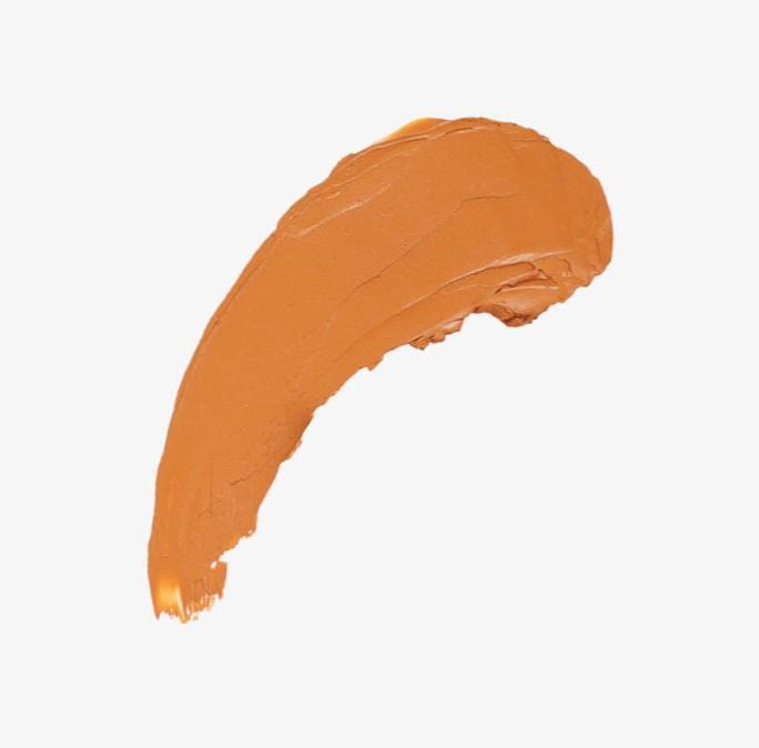 Elaluz Camu Camu bronzer stick in palm for easy face and body application