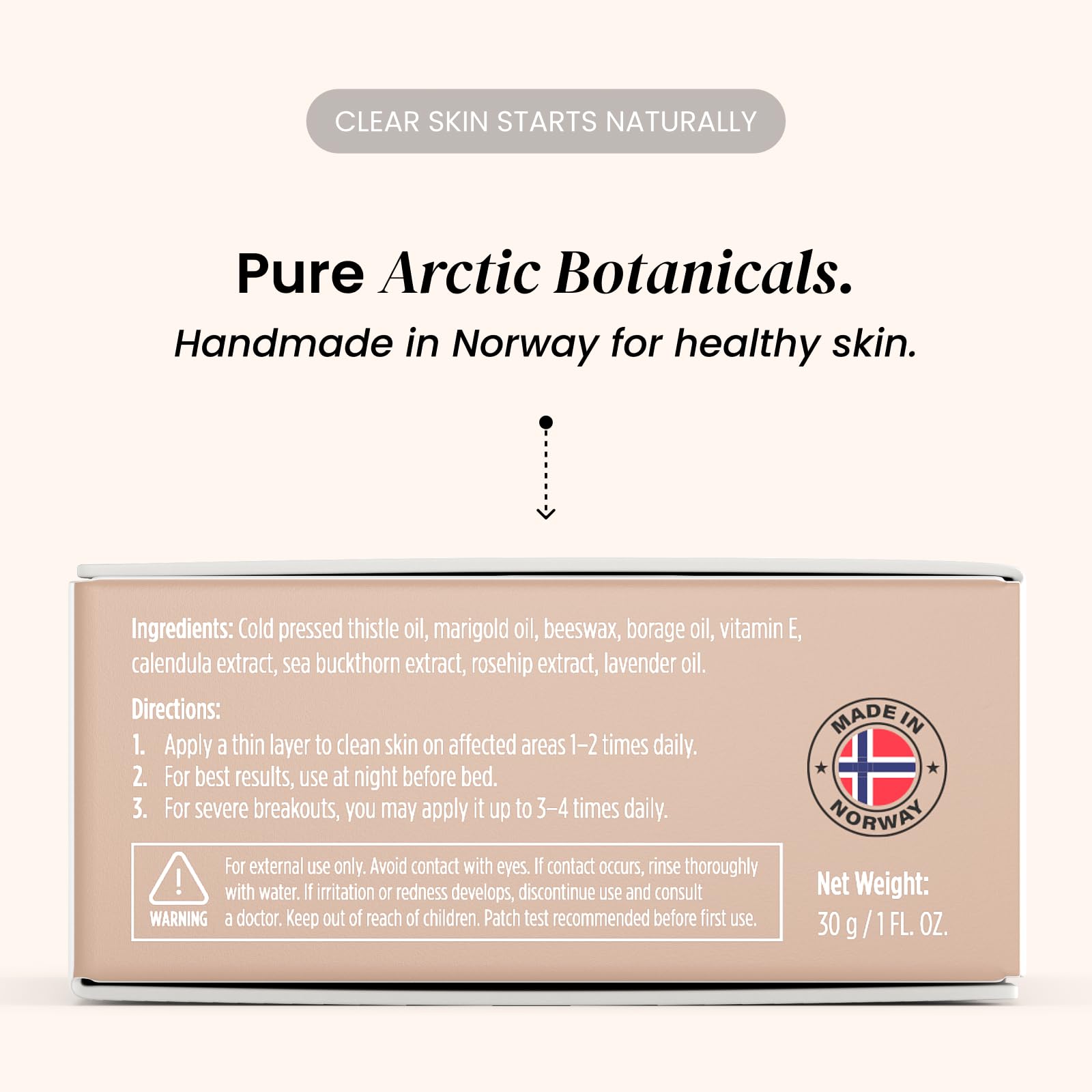 Eliré Clear Skin Balm back-of-hand application shows quick absorption.