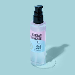 Elizabeth Mott snail mucin serum application routine with fingertips for radiant skin.