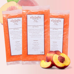 Hands receive ELLA BELLA peach paraffin wax for moisturized, soft skin.