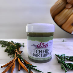 Scoop of Ella Chebe Hair Grease applied through hair for even coverage