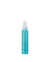 Enjoy Texture and Volume Spray bottle closeup shows curl volume benefits.
