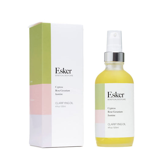 ESKER Clarifying Body Oil bottle on display highlights clean beauty and skin-smoothing potential.