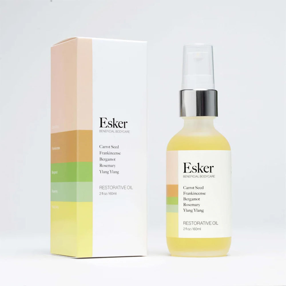ESKER Restorative Body Oil aroma scene captures balsamic, woody notes for mood lift.