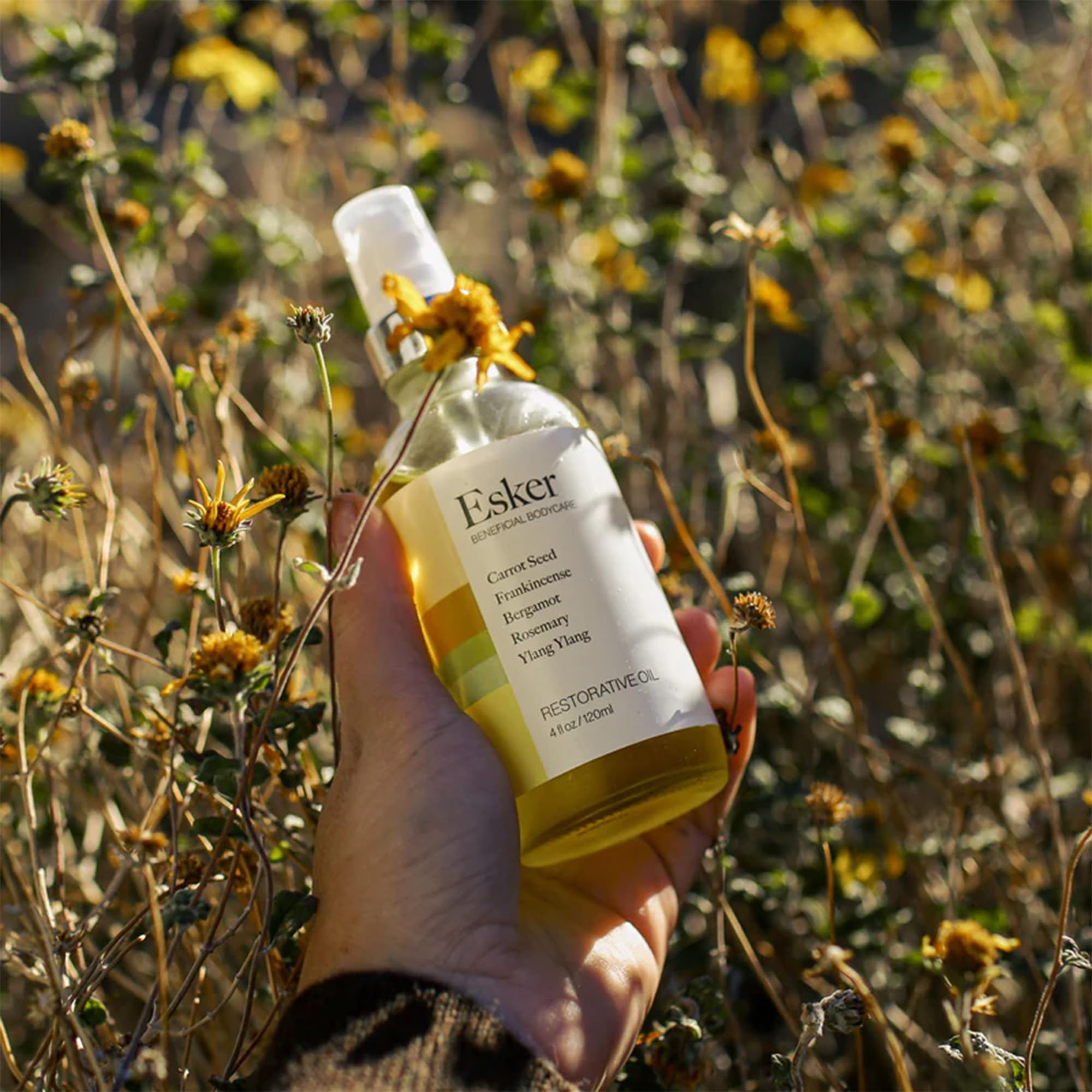 ESKER Restorative Body Oil pump closeup demonstrates easy, fast-absorbing hydration.