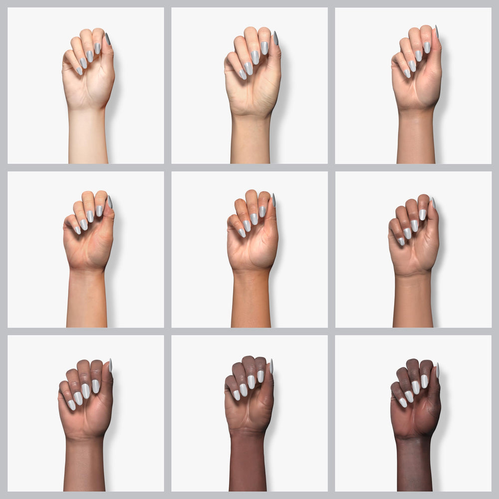 Essie Press Pause nail polish swatch reveals blue-tinted gray shade for modern nails.