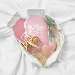 Six-pack ESW Beauty Strawberries & Cream box on a vanity with soft lighting.