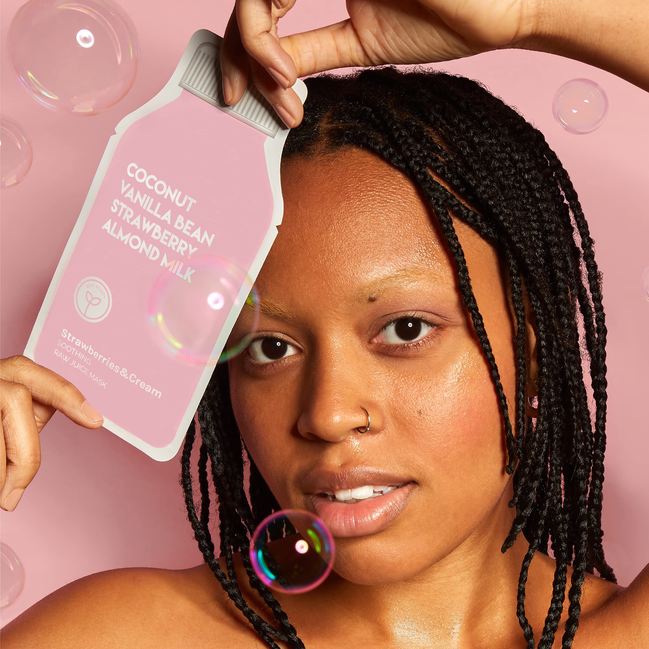 User applying ESW Beauty Strawberries & Cream mask with calming, cooling feel.