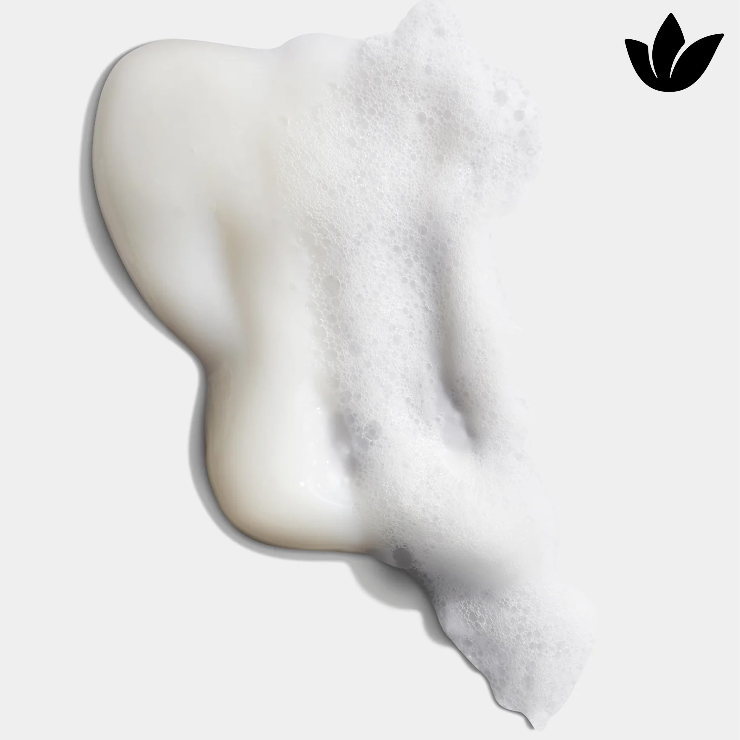 Shampoo bottle with splash suggesting refreshing, hydrating cleanse