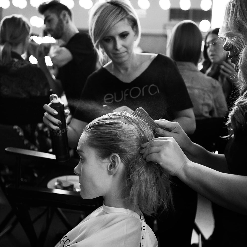 Eufora Straightening Balm being applied for smooth, frizz-free styling.