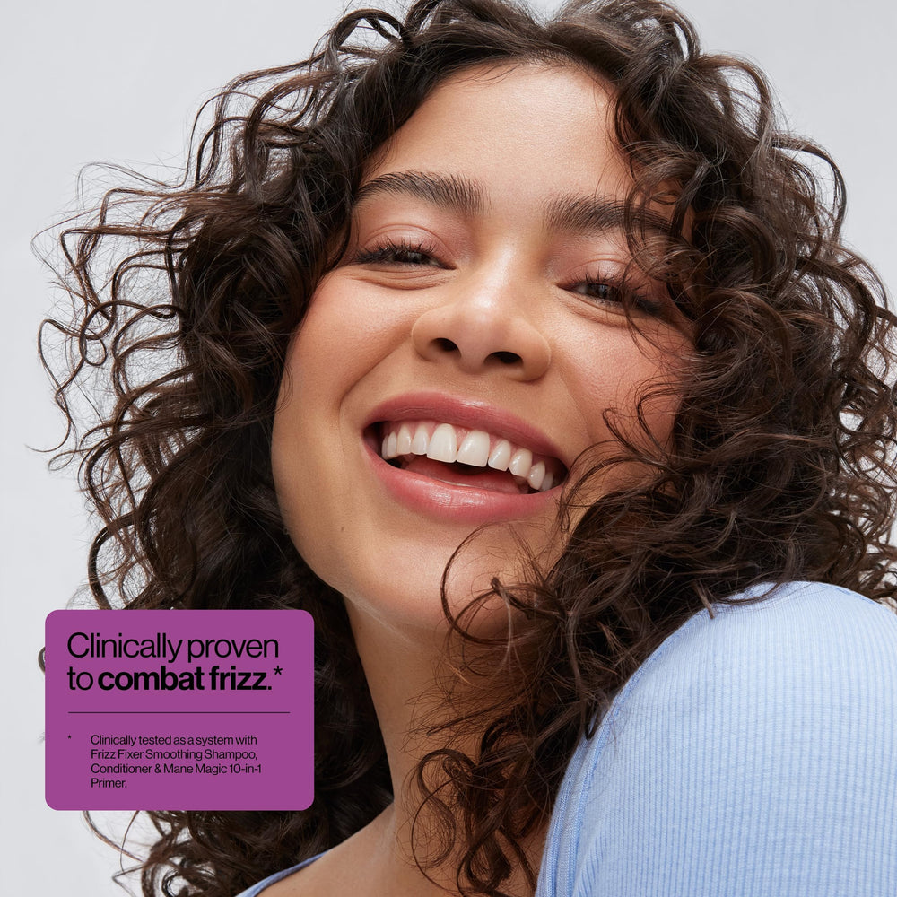 Hands applying Eva NYC Anti-Frizz Conditioner for even distribution.