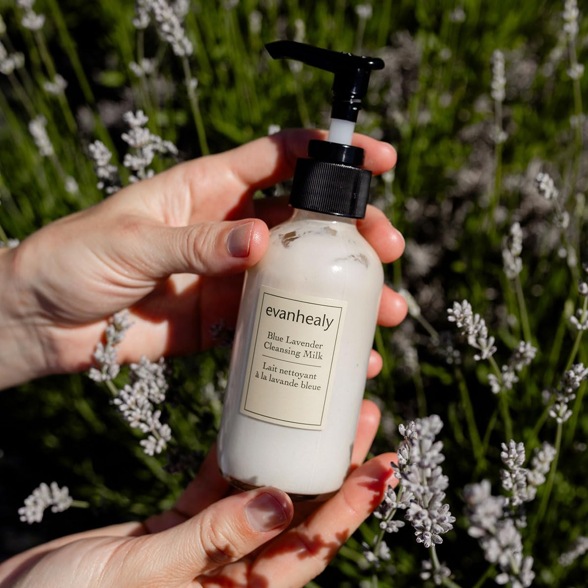 hands massaging evanhealy cleansing milk for a mild cleanse