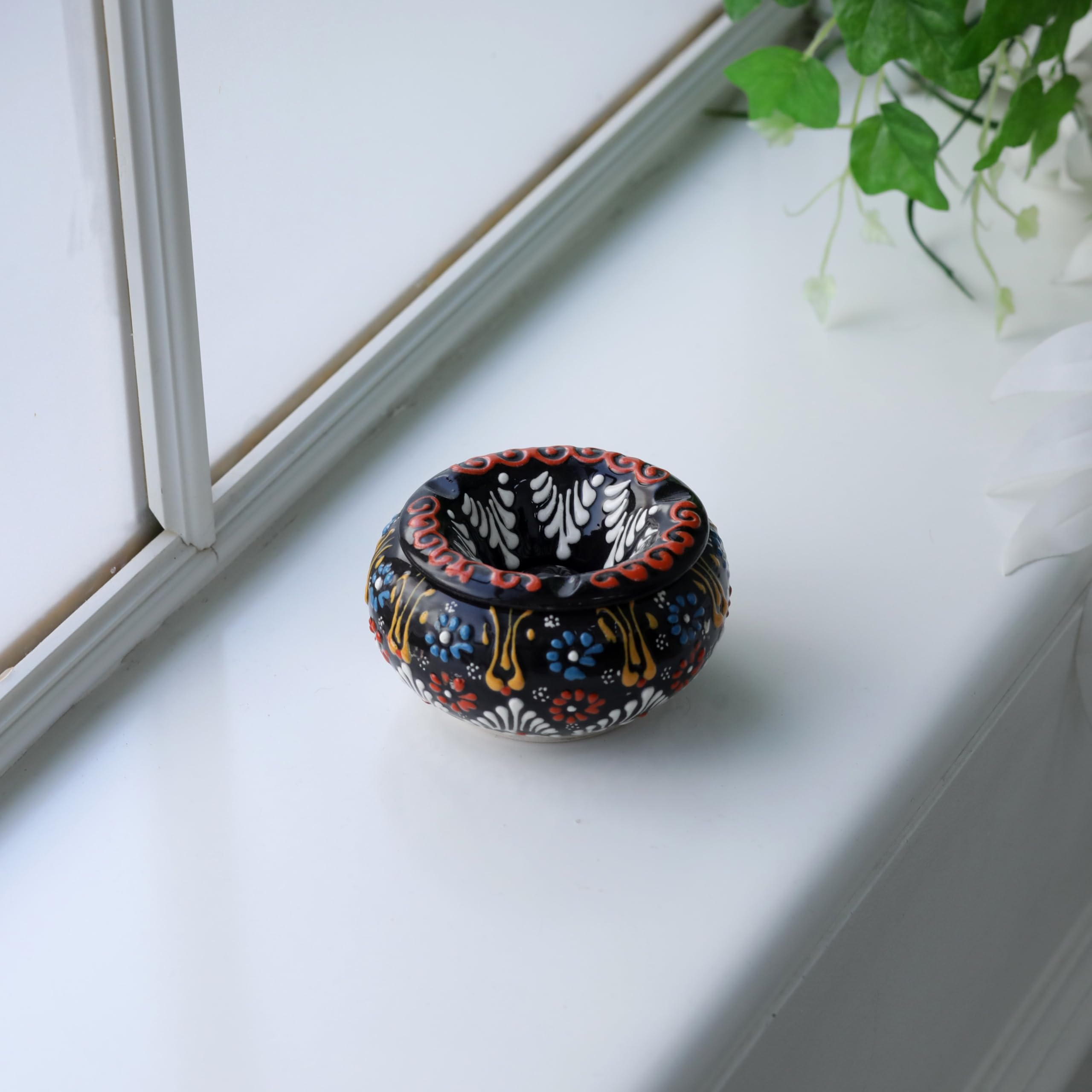 EVANILIFE handmade ceramic jar with ornate patterns, a striking focal point.